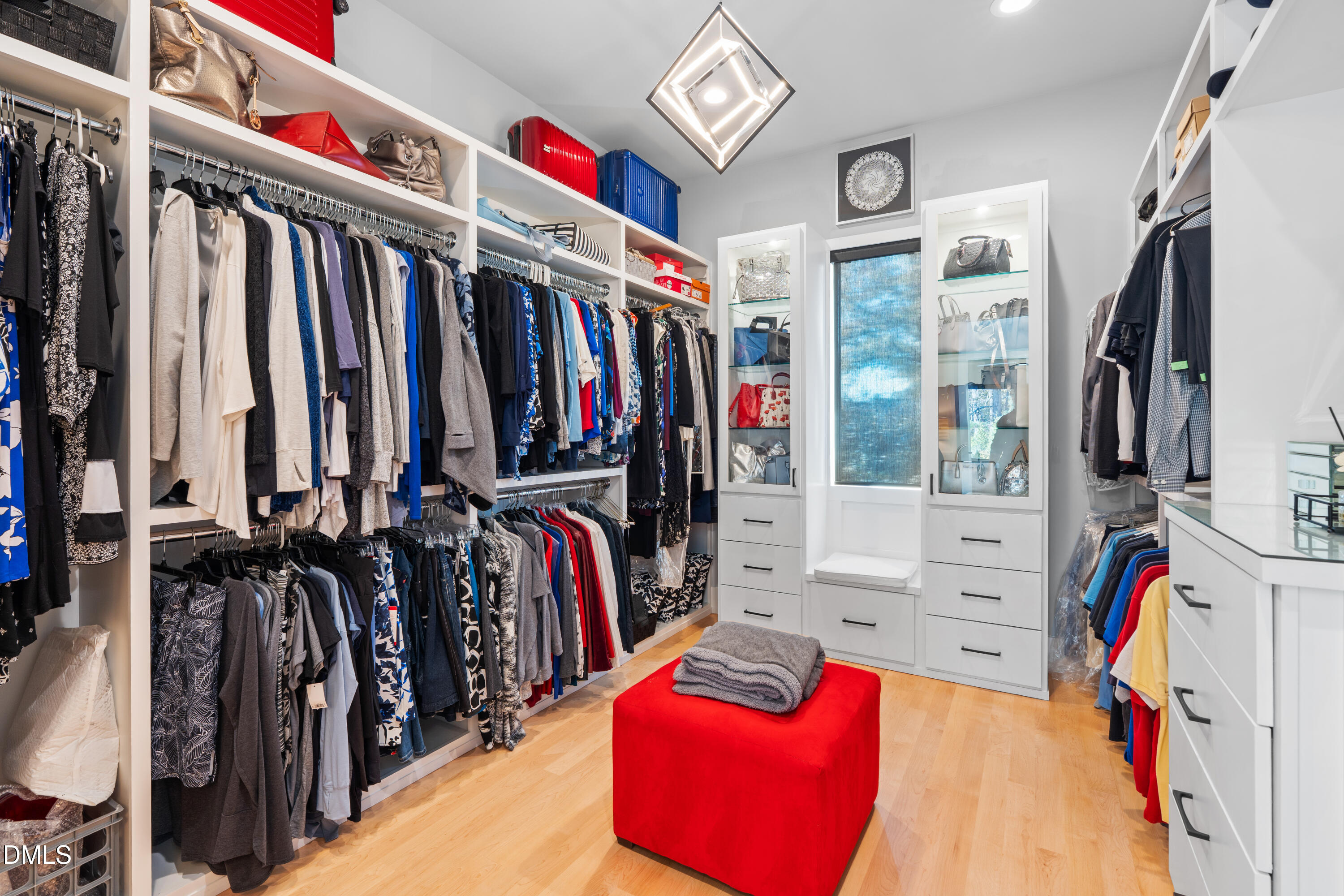 132 Edward Booth Lane Durham, NC 27713 - Photo 31 of 75 a view of walk in closet with clothes and shoes
