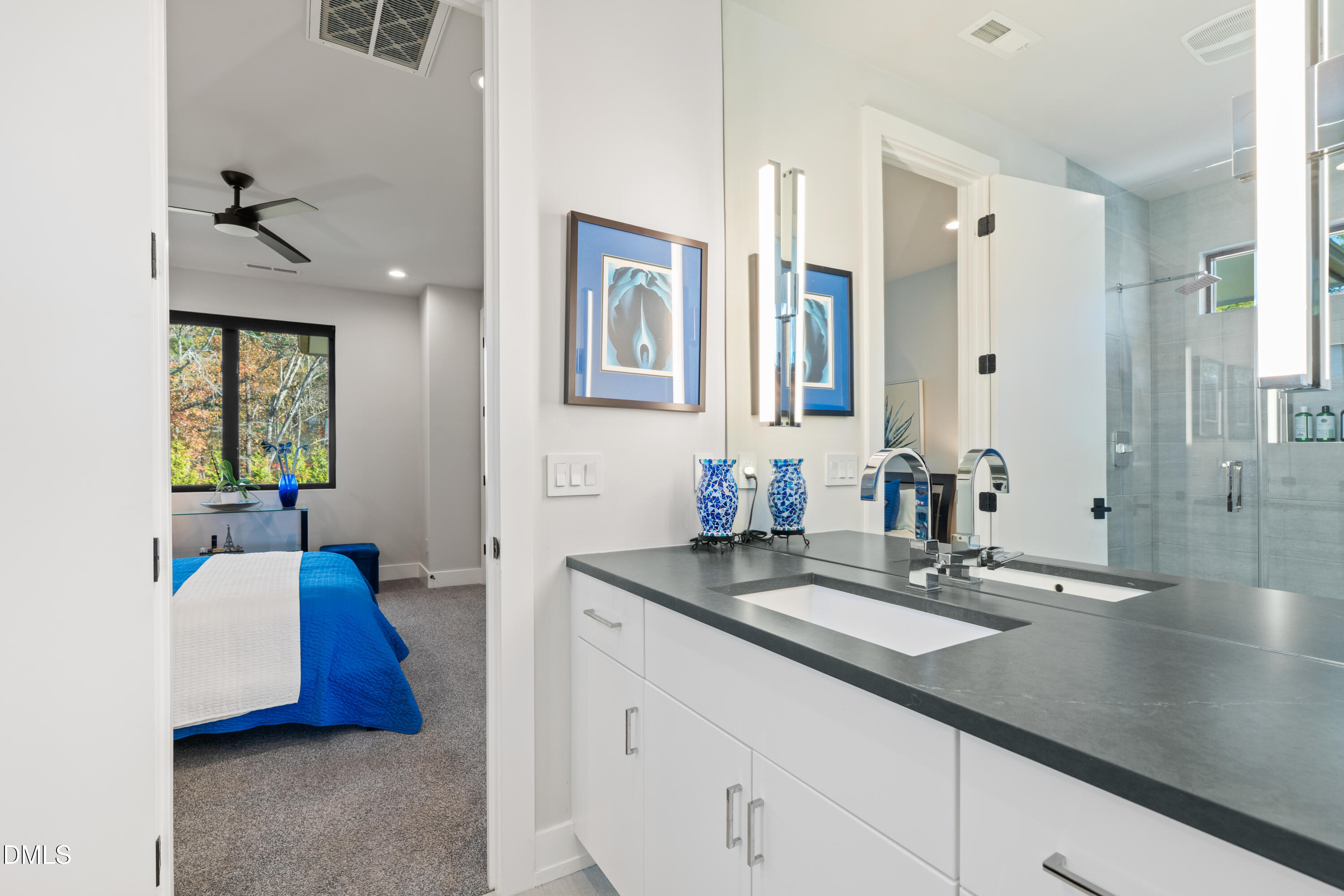 132 Edward Booth Lane Durham, NC 27713 - Photo 42 of 75 a en suite bathroom with double vanity sinks and a mirror
