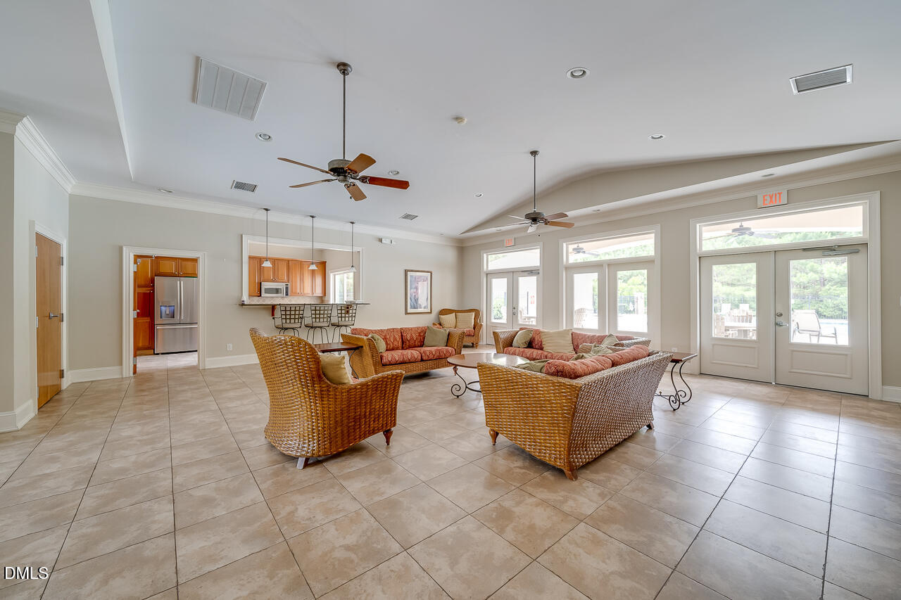 132 Edward Booth Lane Durham, NC 27713 - Photo 69 of 75 a living room with furniture and a chandelier