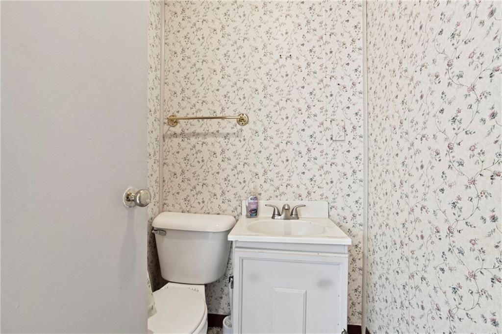1807 Pine Hollow Road McKees Rocks, PA 15136 - Photo 11 of 47 a bathroom with a toilet and a sink