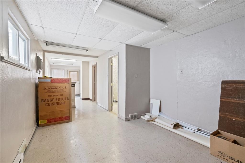1807 Pine Hollow Road McKees Rocks, PA 15136 - Photo 13 of 47 an empty room with furniture and a window