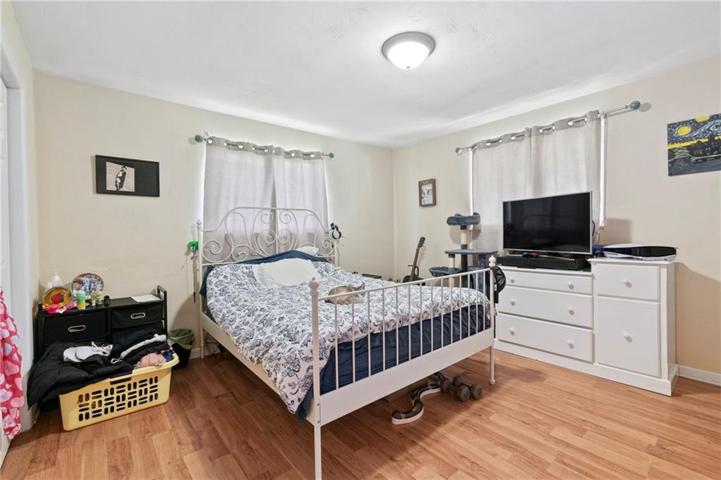 1807 Pine Hollow Road McKees Rocks, PA 15136 - Photo 14 of 47 a bedroom with a bed and a flat screen tv