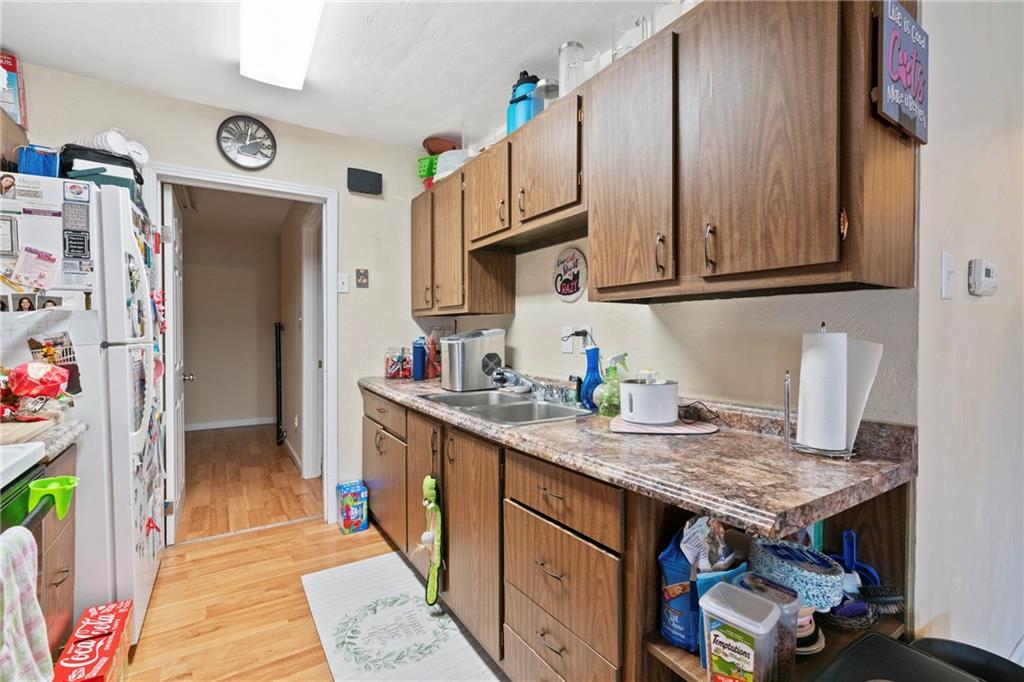 1807 Pine Hollow Road McKees Rocks, PA 15136 - Photo 20 of 47 a kitchen with granite countertop a sink stove and cabinets