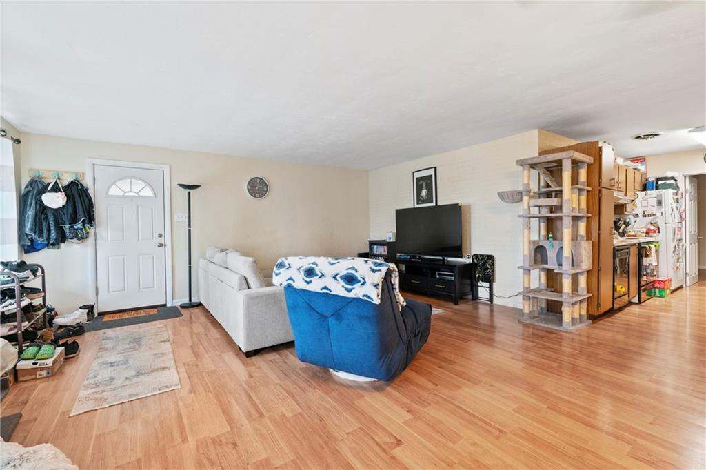 1807 Pine Hollow Road McKees Rocks, PA 15136 - Photo 23 of 47 a living room with furniture and a flat screen tv