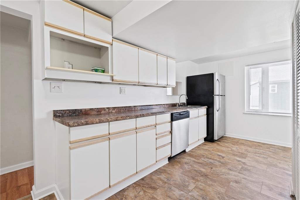 1807 Pine Hollow Road McKees Rocks, PA 15136 - Photo 28 of 47 a kitchen with white cabinets and white appliances