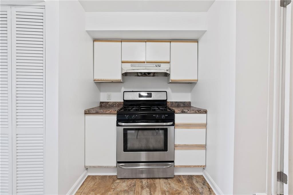 1807 Pine Hollow Road McKees Rocks, PA 15136 - Photo 29 of 47 a stove top oven sitting inside of a kitchen