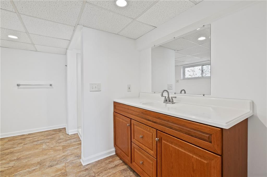 1807 Pine Hollow Road McKees Rocks, PA 15136 - Photo 30 of 47 a bathroom with a sink double vanity and a mirror