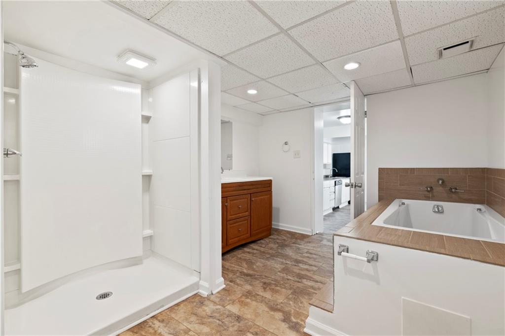 1807 Pine Hollow Road McKees Rocks, PA 15136 - Photo 31 of 47 a bathroom with a bathtub sink and a shower