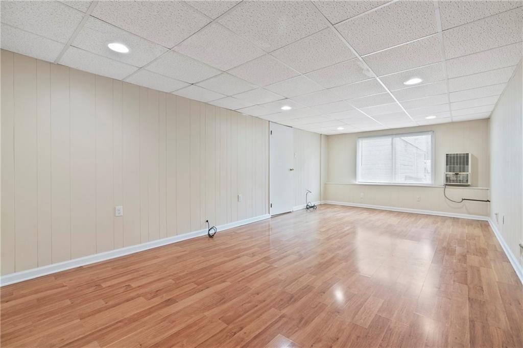 1807 Pine Hollow Road McKees Rocks, PA 15136 - Photo 34 of 47 a view of an empty room with wooden floor and windows