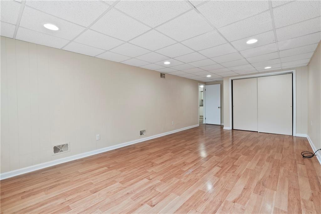 1807 Pine Hollow Road McKees Rocks, PA 15136 - Photo 35 of 47 a view of an empty room with wooden floor