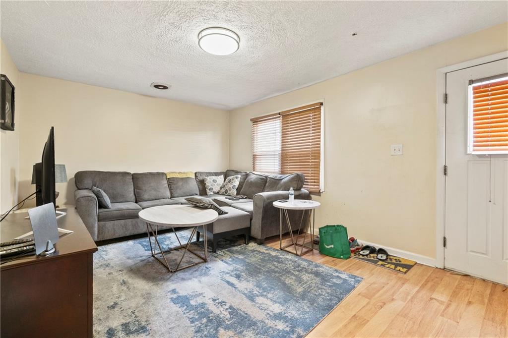 1807 Pine Hollow Road McKees Rocks, PA 15136 - Photo 4 of 47 a living room with furniture and a window