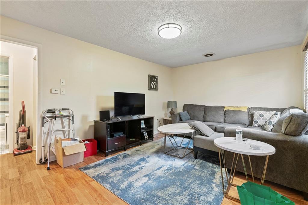 1807 Pine Hollow Road McKees Rocks, PA 15136 - Photo 5 of 47 a living room with furniture and a flat screen tv