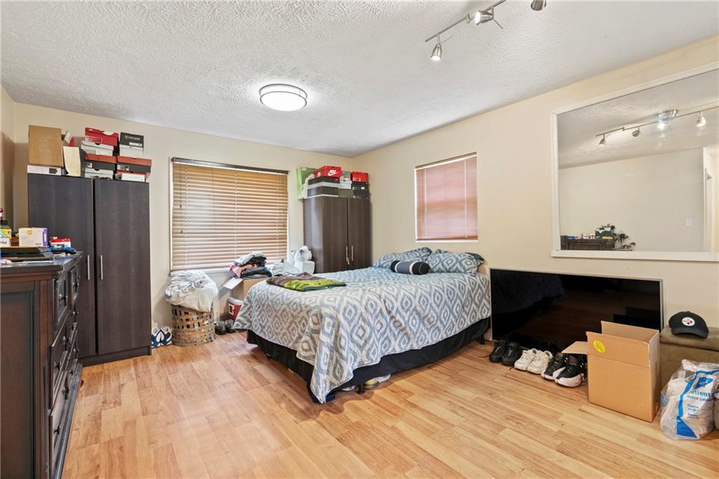 1807 Pine Hollow Road McKees Rocks, PA 15136 - Photo 7 of 47 a bedroom with a bed and a dresser