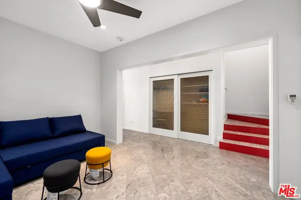 a view of room with furniture and wooden floor