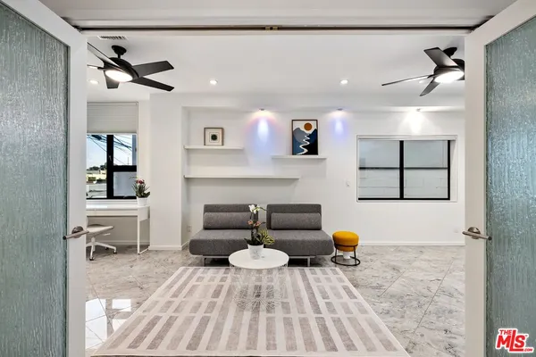 a living room with furniture and a rug