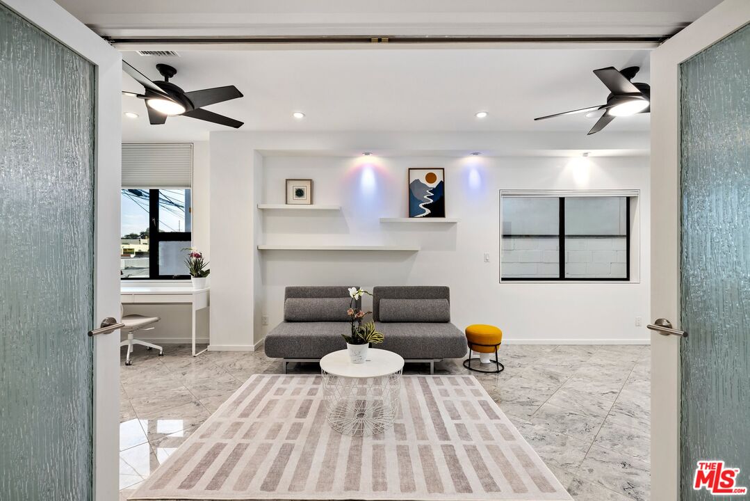 3007 Ocean Front Walk Venice, CA 90291 - Photo 16 of 33 a living room with furniture and a rug