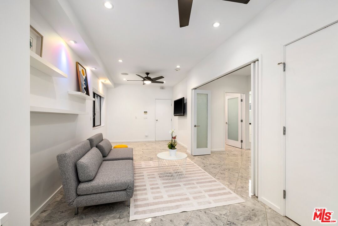 3007 Ocean Front Walk Venice, CA 90291 - Photo 18 of 33 a living room with furniture and a chandelier