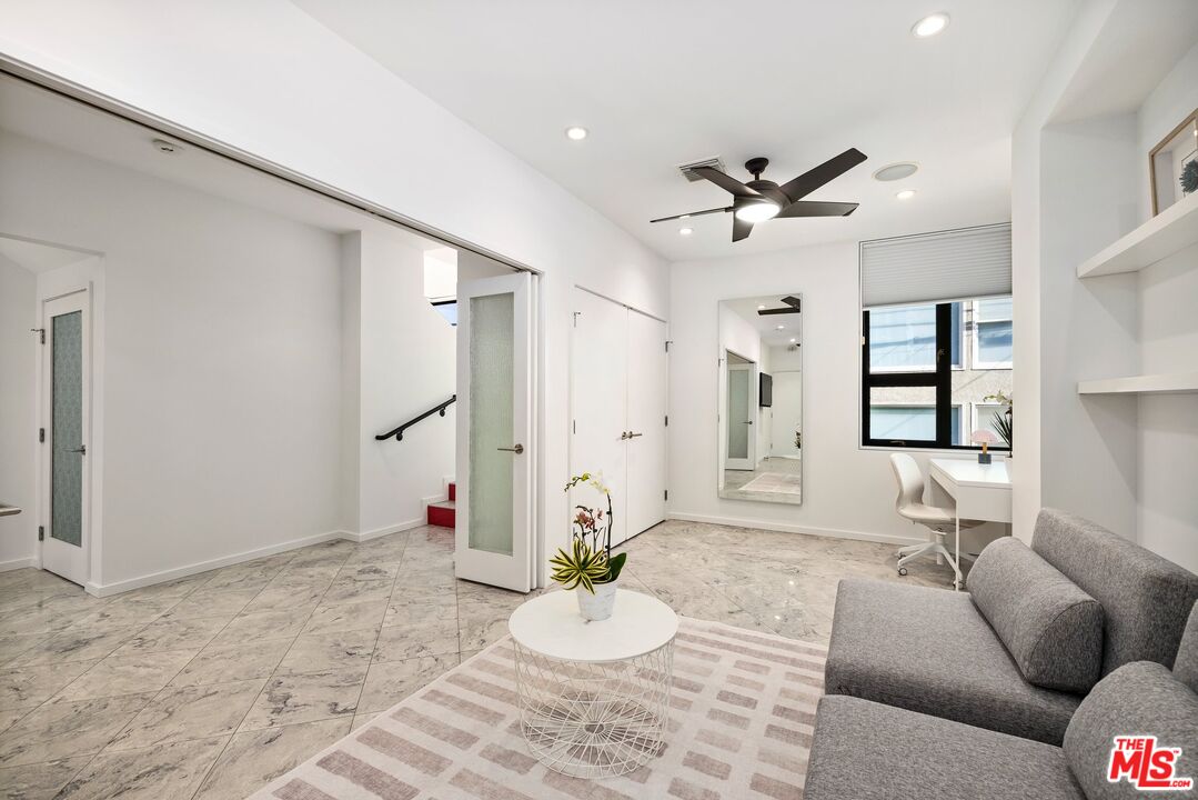 3007 Ocean Front Walk Venice, CA 90291 - Photo 19 of 33 a living room with furniture and a chandelier