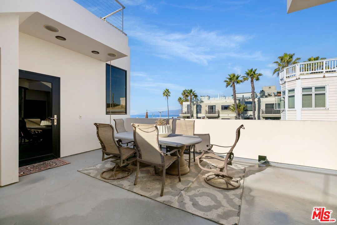 3007 Ocean Front Walk Venice, CA 90291 - Photo 28 of 33 a view of a patio with table and chairs