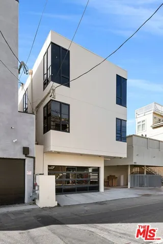 a front view of a building with garage