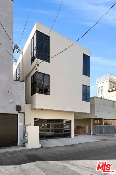 3007 Ocean Front Walk Venice, CA 90291 - Photo 31 of 33 a front view of a building with garage