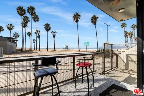 a view of a swimming pool with a table and chairs