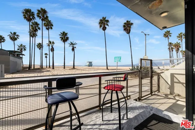 a view of a swimming pool with a table and chairs