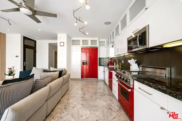 a kitchen with stainless steel appliances granite countertop a stove and a sink