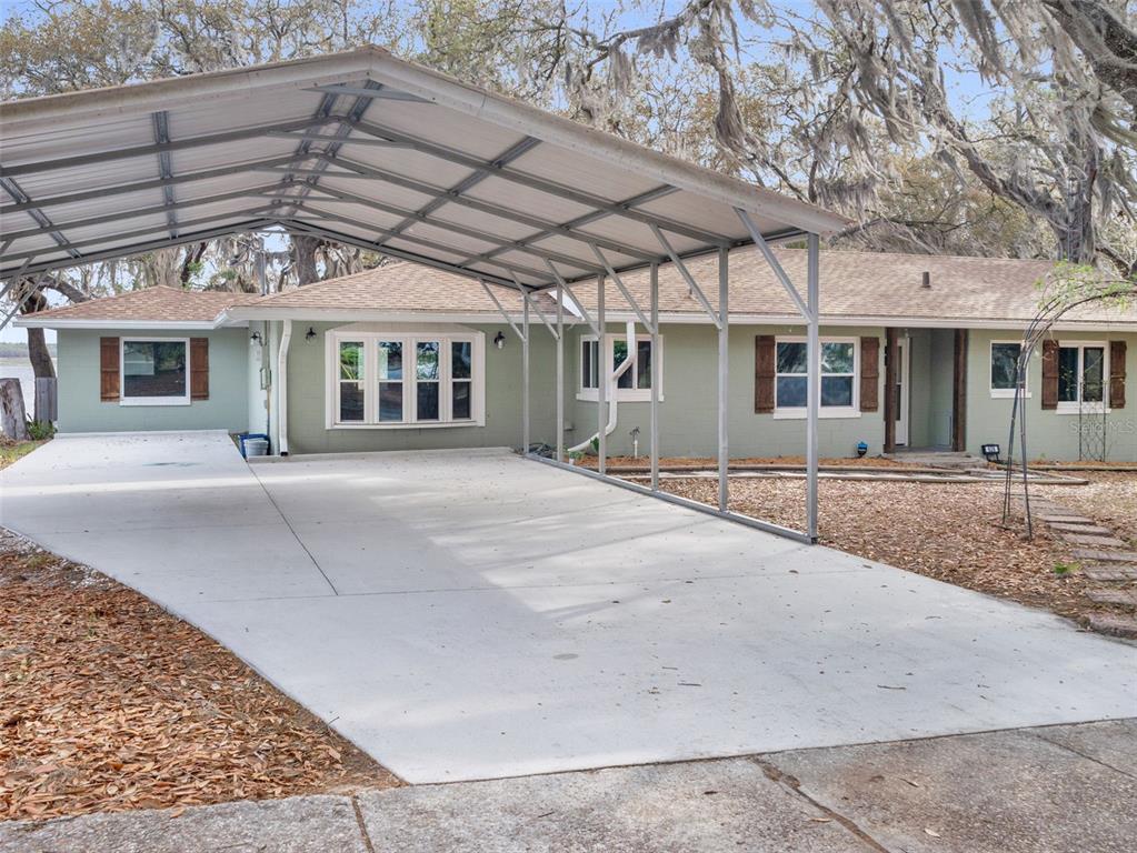 628 Bethel Street Keystone Heights, FL 32656 - Photo 1 of 49 a front view of a house with a garden