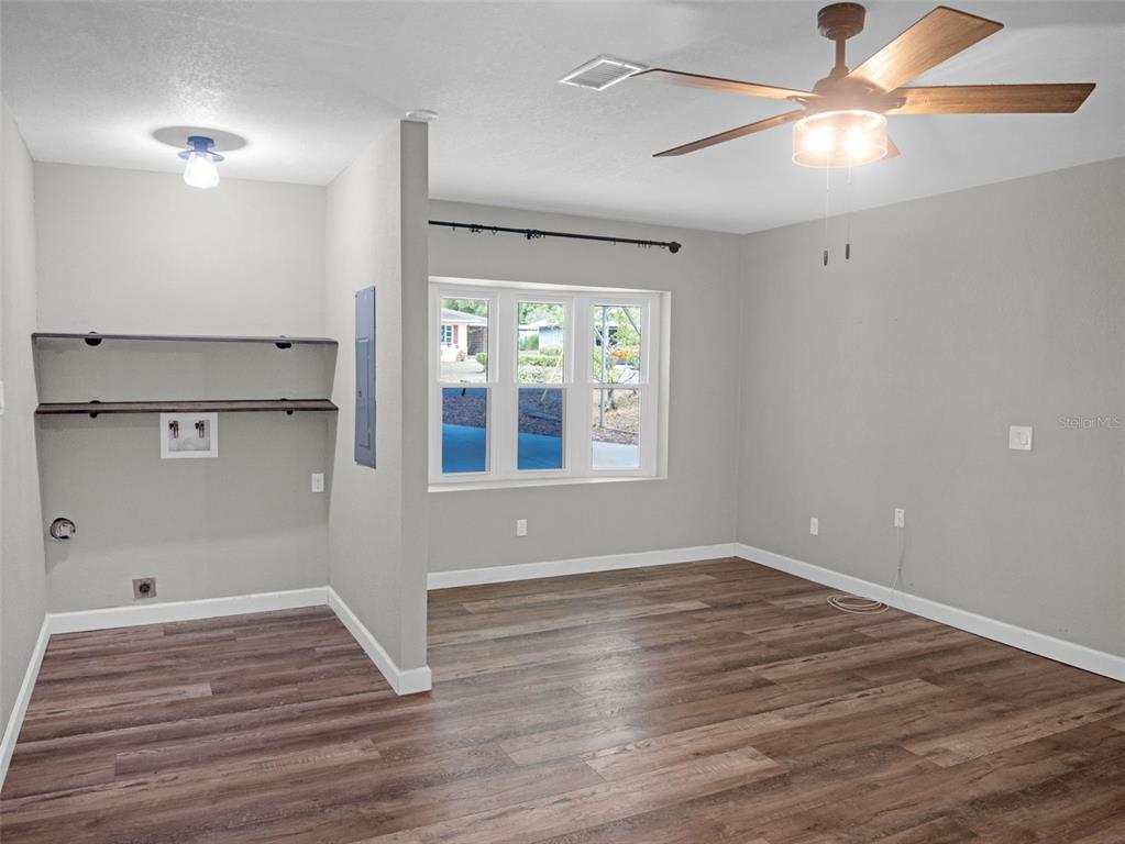 628 Bethel Street Keystone Heights, FL 32656 - Photo 15 of 49 a view of empty room with wooden floor and fan