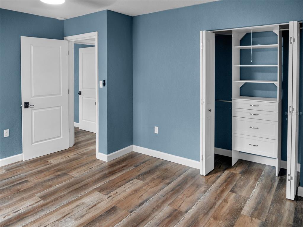 628 Bethel Street Keystone Heights, FL 32656 - Photo 23 of 49 a view of a bedroom with closet and cabinet