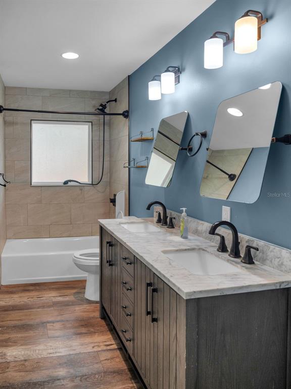628 Bethel Street Keystone Heights, FL 32656 - Photo 26 of 49 a bathroom with a double vanity sink and a mirror