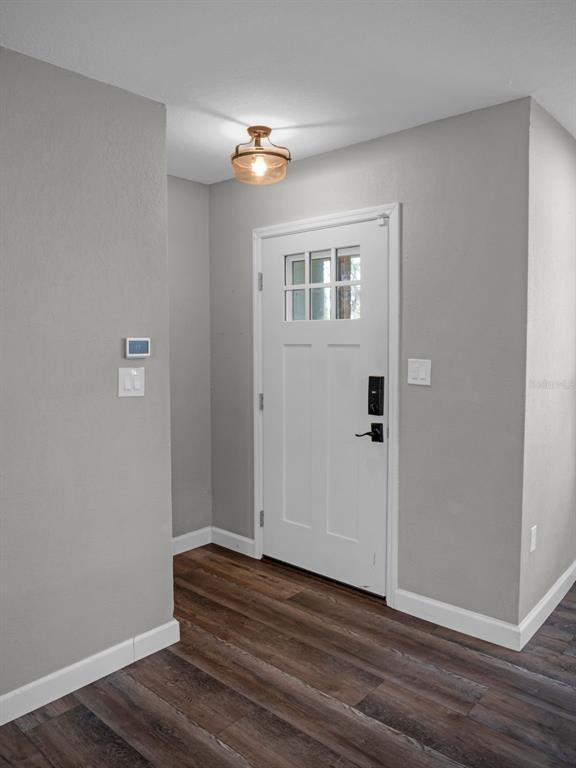 628 Bethel Street Keystone Heights, FL 32656 - Photo 3 of 49 a view of a livingroom with wooden floor