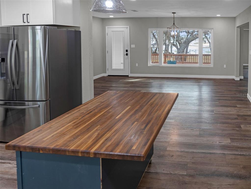 628 Bethel Street Keystone Heights, FL 32656 - Photo 4 of 49 a room with wooden floor and large window