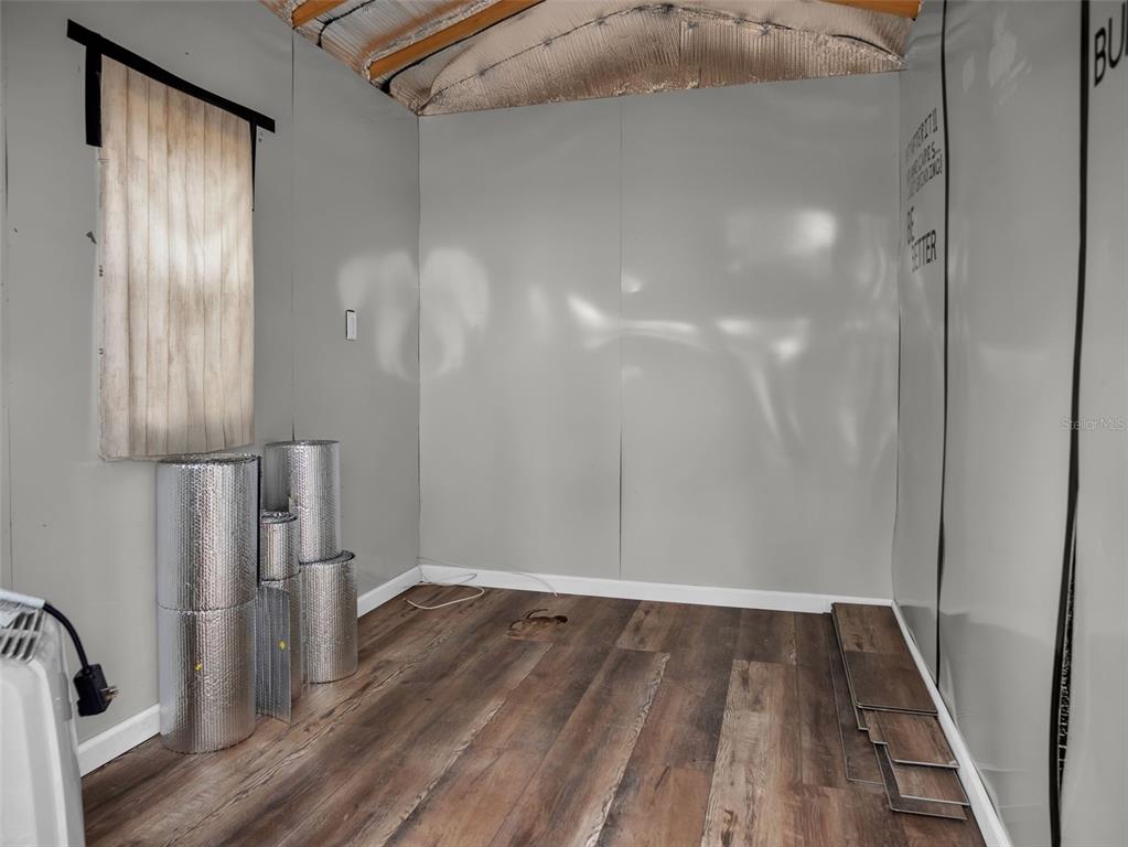 628 Bethel Street Keystone Heights, FL 32656 - Photo 42 of 49 a view of a room with wooden floor