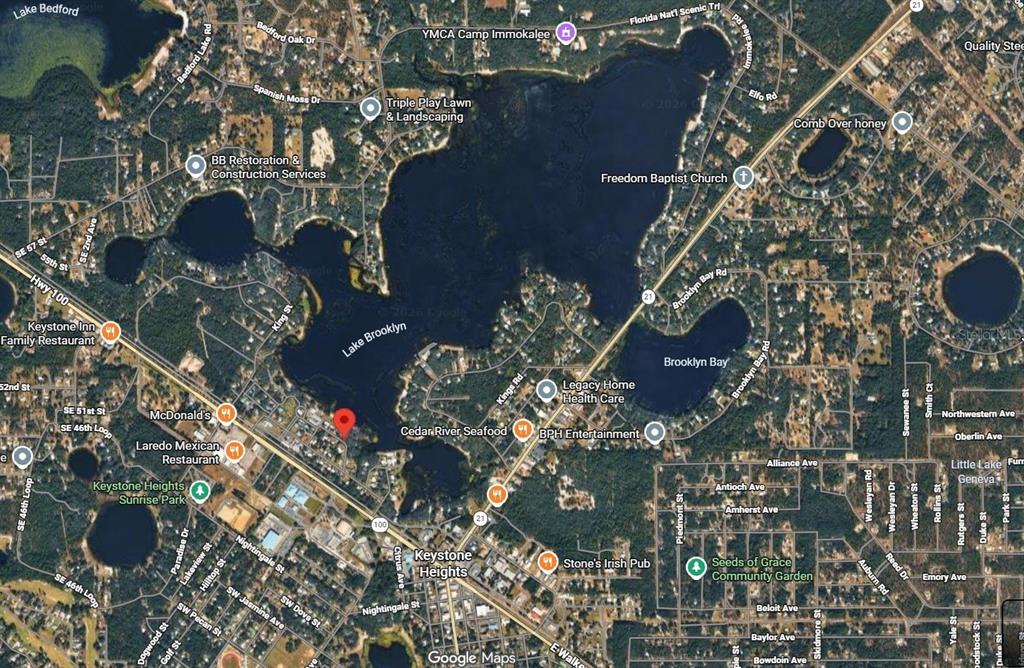 628 Bethel Street Keystone Heights, FL 32656 - Photo 49 of 49 an aerial view of waterside residential building and tree