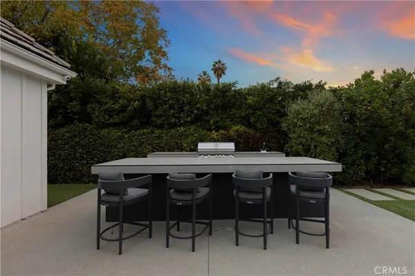 a patio with table and chairs