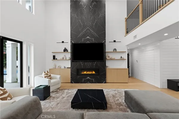 a living room with furniture and a fireplace