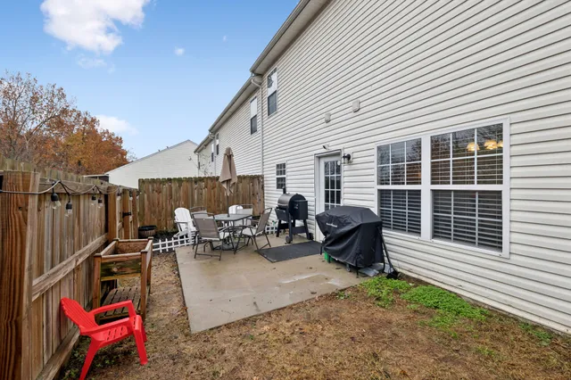 a backyard of a house with seating space