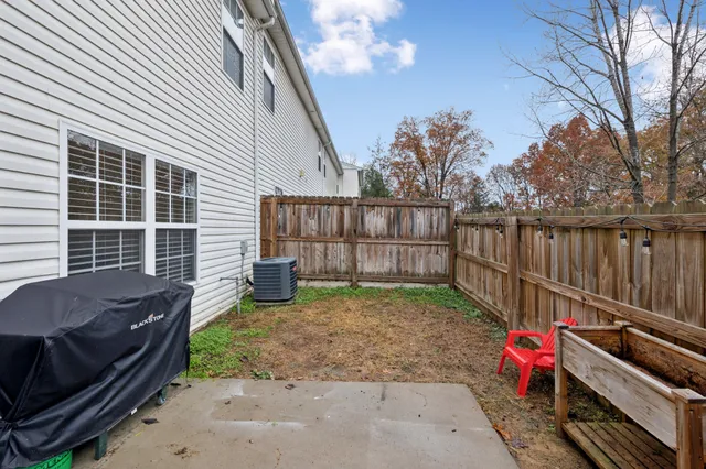 an aerial view of a house with outdoor space