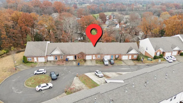 an aerial view of a house with outdoor space
