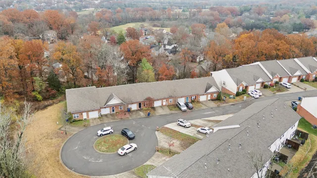 an aerial view of a house with outdoor space