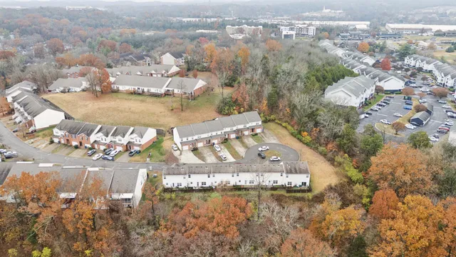 an aerial view of a house with yard
