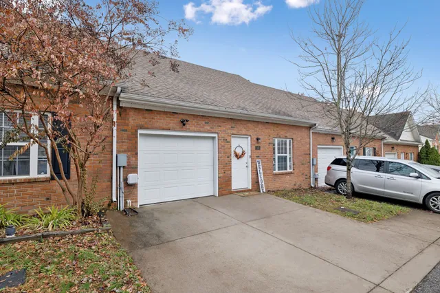 a front view of a house with a outdoor space