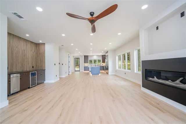 a view of a kitchen with a sink and a stove top oven