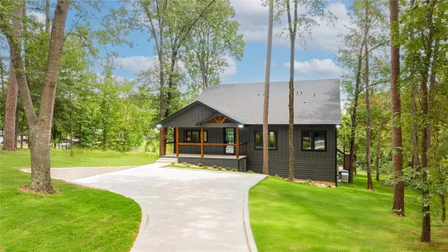a front view of a house with a yard table and chairs