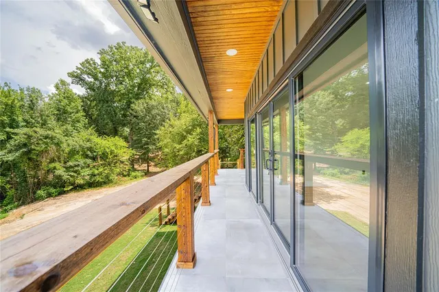 a view of a backyard with wooden fence