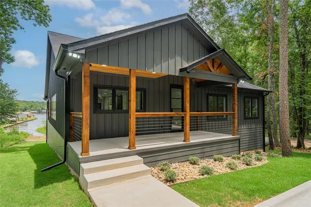 a view of small house with backyard