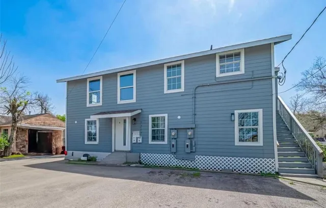 a front view of a house with a garage