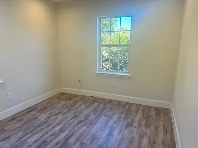 a bathroom with a sink a mirror and a toilet